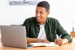 Student taking online course from laptop